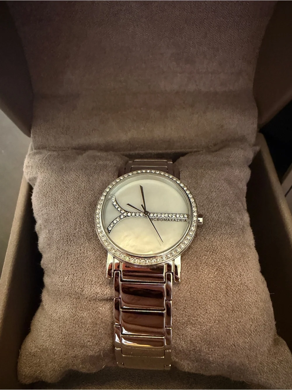 BCBGMAXAZRIA silver watch with diamond accents. Needs battery.